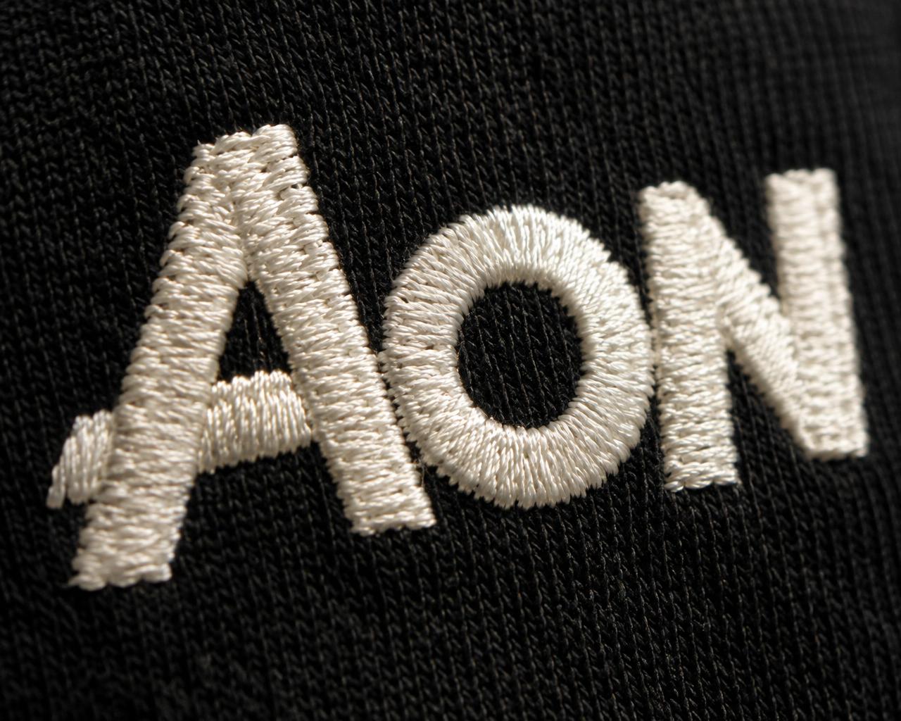Close-up of embroidered AON logo